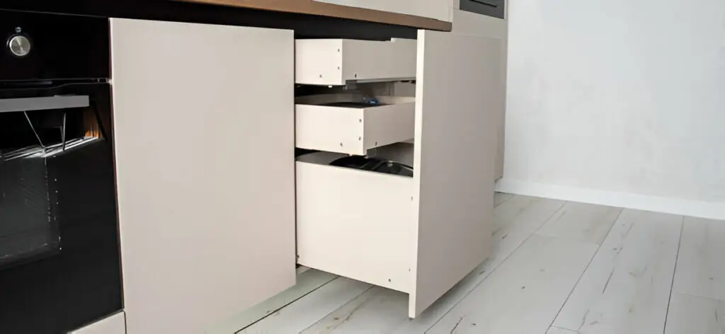 Hidden Kitchen Cabinet Storage Ideas You Need to Try 2 Opened kitchen cabinet showing internal drawer organization